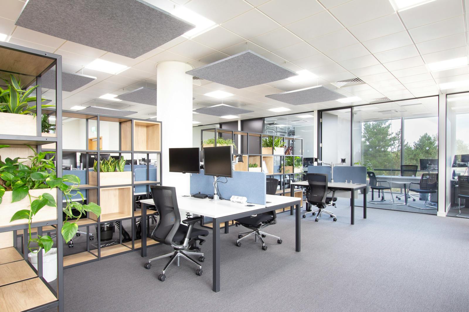 Desks and office chairs in a commercial workspace