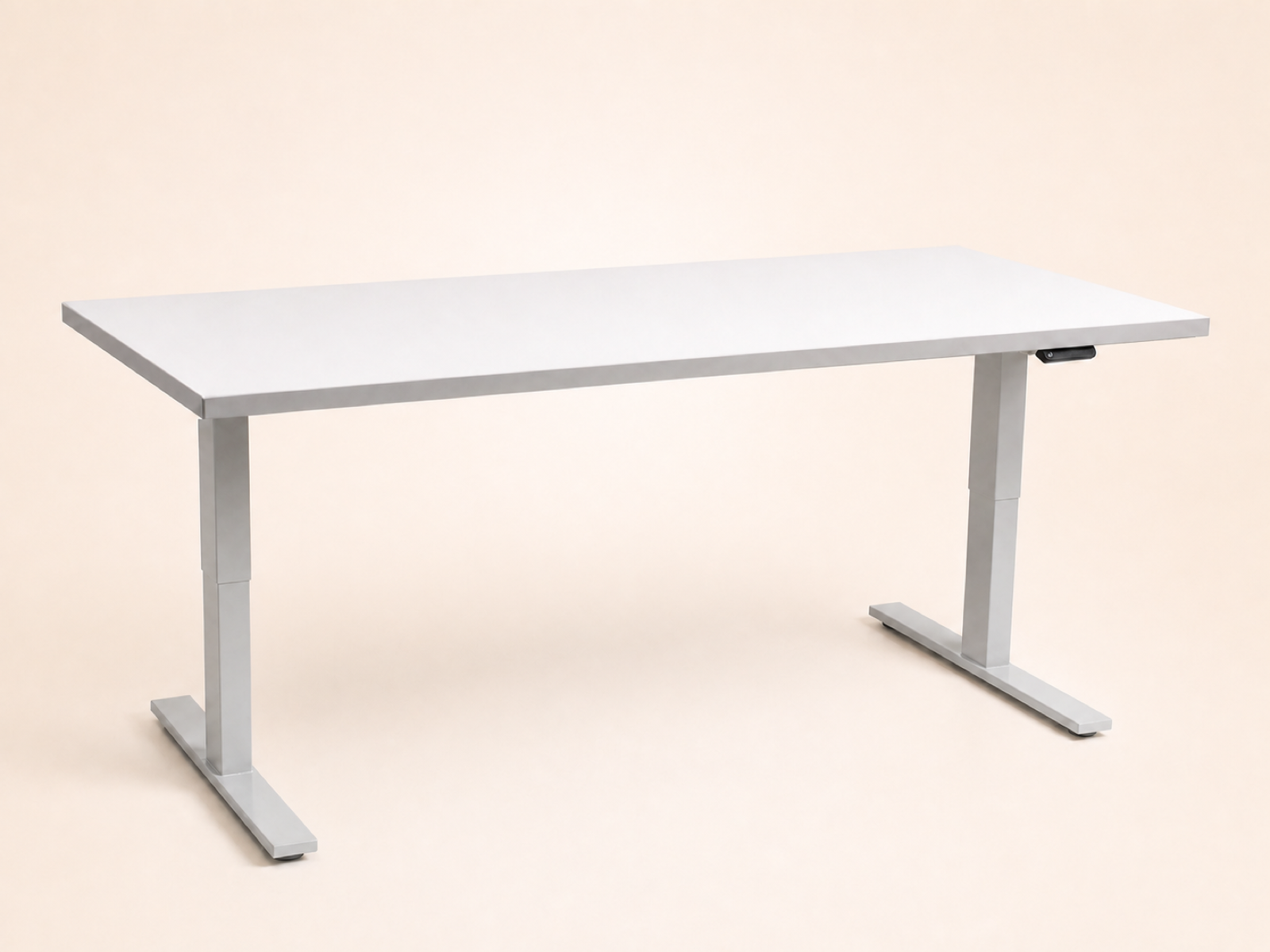 White Poppin electric desk with height-adjustable legs.